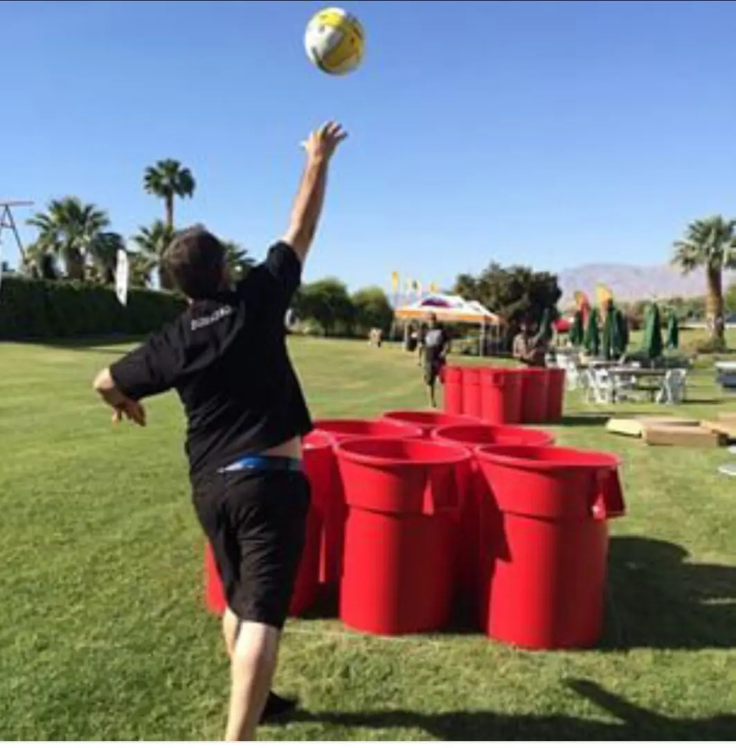 Man playing giant beer pong